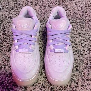 Size 6.5 woman’s Nike fabric purple air forces. Lightly worn, new laces.